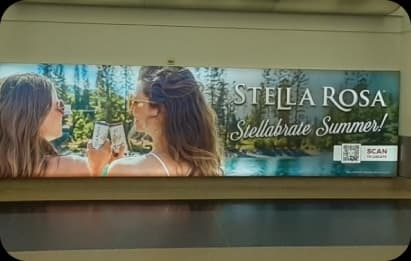 airport length billboard for stella rosa drinks with QR code